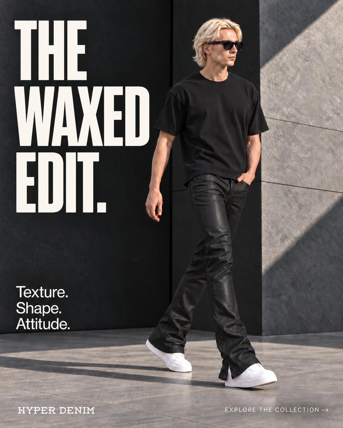 The Waxed Edit by Hyper Denim: model in black flared pants and white sneakers beside modern stone architecture.